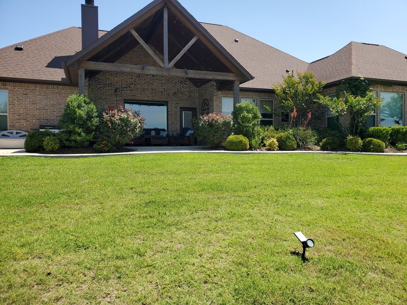 Mature landscaping with green lawn