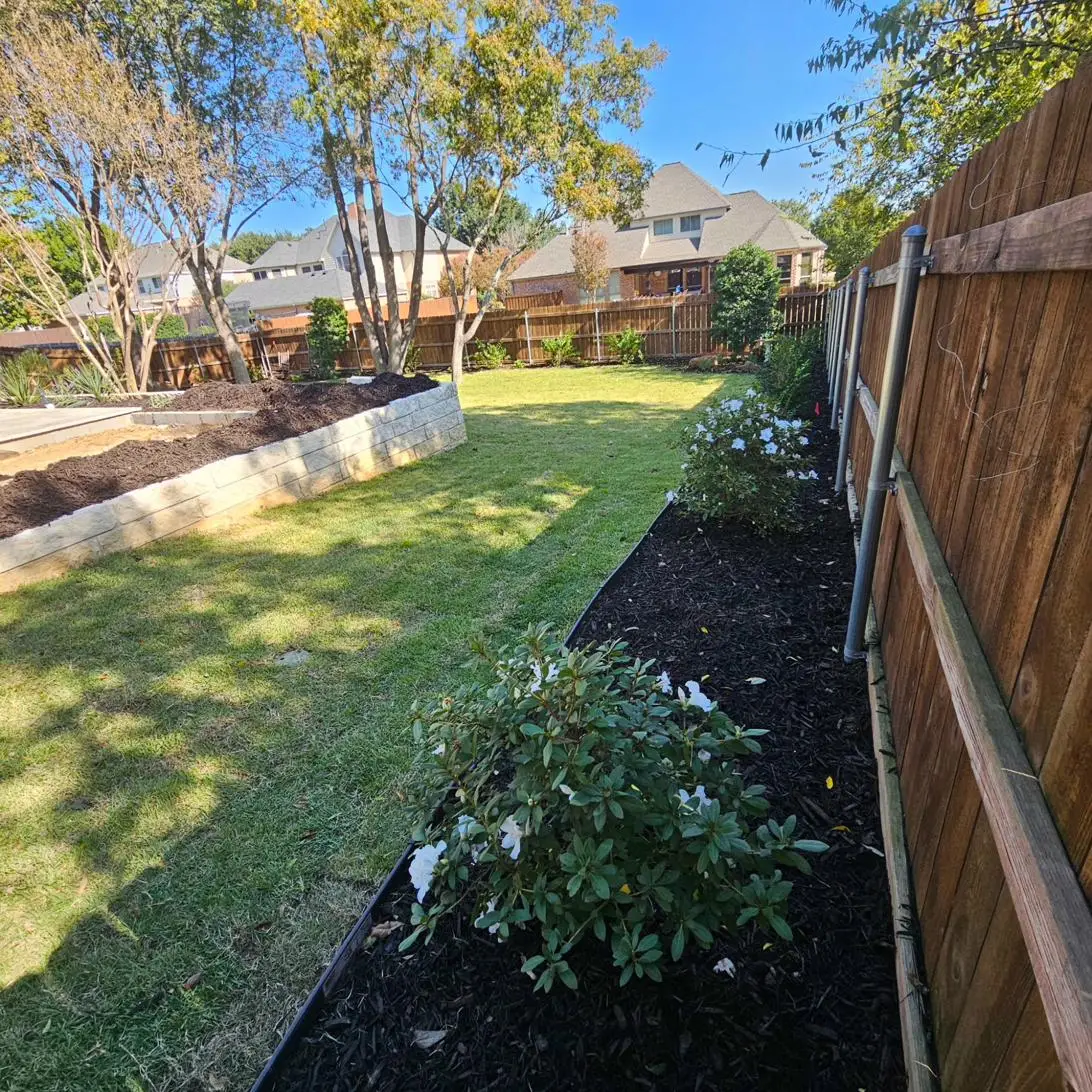 Curved mulch beds with plantings