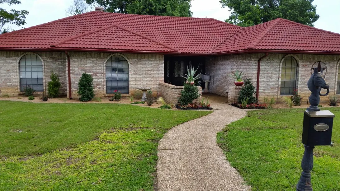 Front yard with winding walkway and fresh plantings